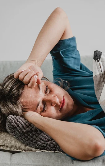 Person feeling exhausted and overwhelmed